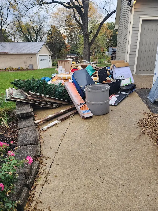 Dumpster being loaded with debris for Roofing Dumpster Rental in Creston